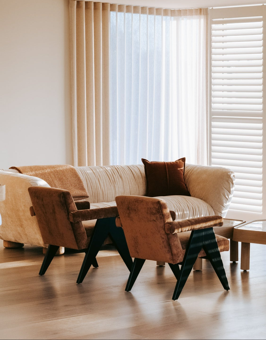 brown  bronze velvet armchairs with dark wooden legs