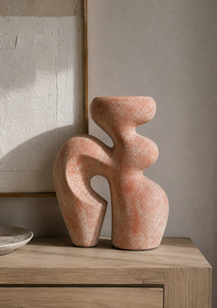 abstract terracotta-colored stone sculpture 