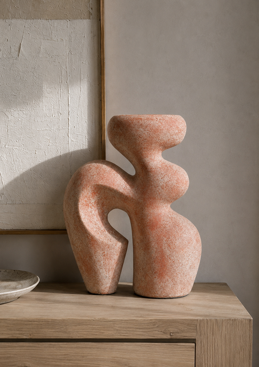 abstract terracotta-colored stone sculpture 