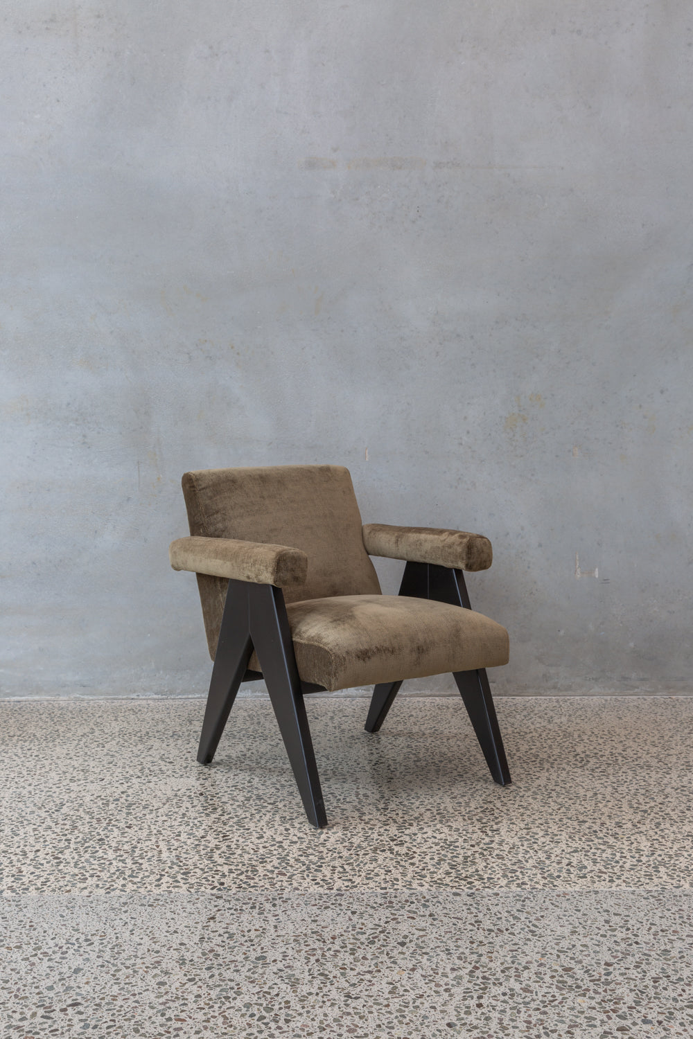 brown earth velvet armchairs with dark wooden legs
