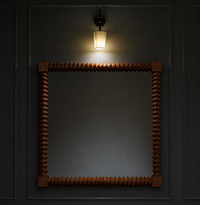A square wooden mirror with a decorative carved frame, mounted on a dark paneled wall under a hanging light fixture.