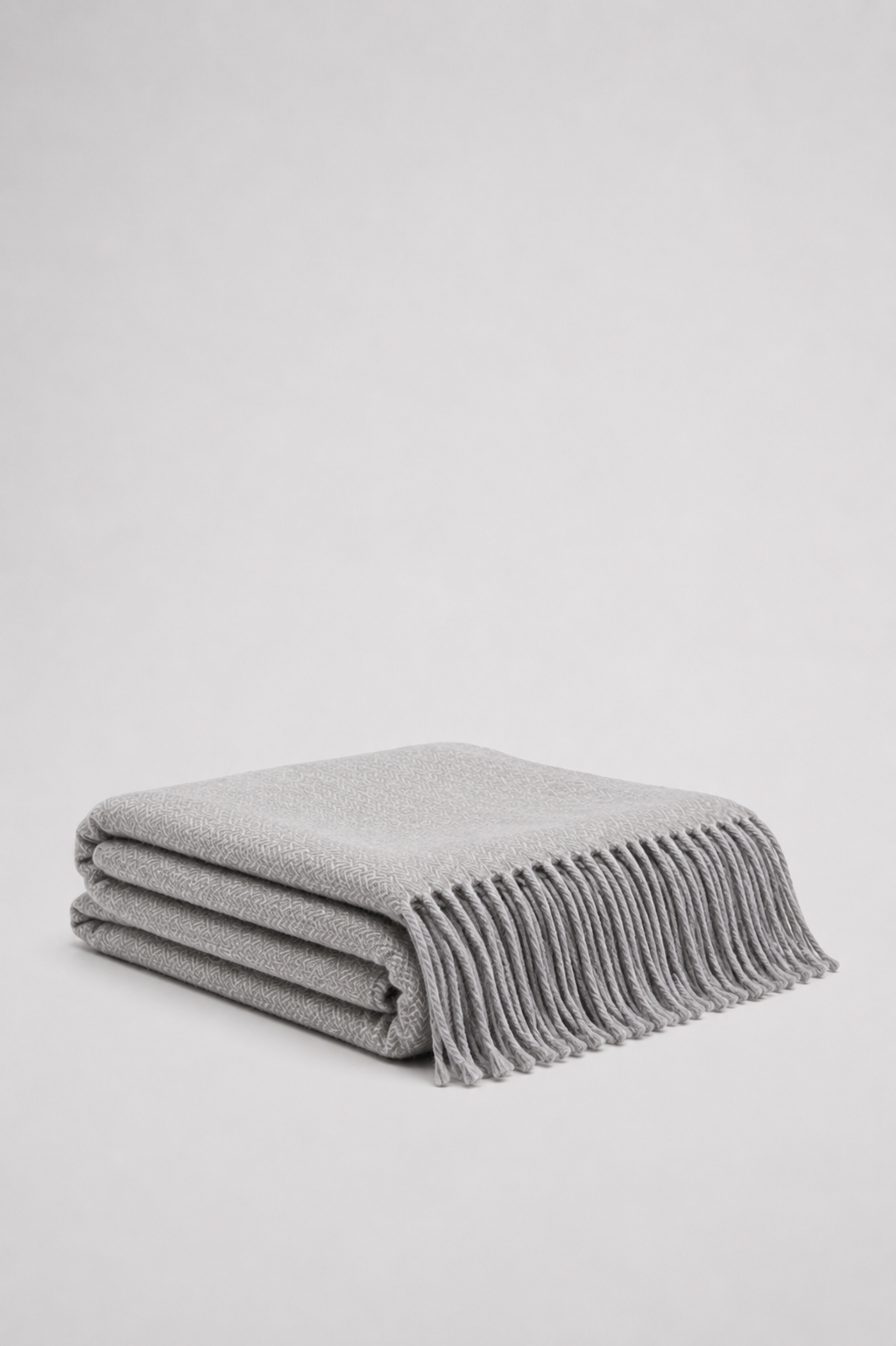  grey soft woven knit throw blanket with a textured diamond pattern and fringe - reversible
