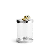 glass canisters with silver-toned steel bases and floral lids