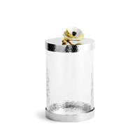 glass canisters with silver-toned steel bases and floral lids